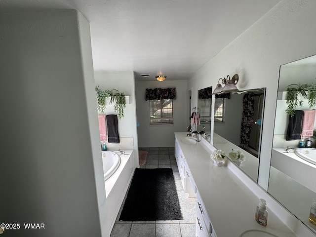 7525 E E Sherwood Rd, Snowflake, AZ 85937 - full bathroom featuring a garden tub, double vanity, and tile patterned floors