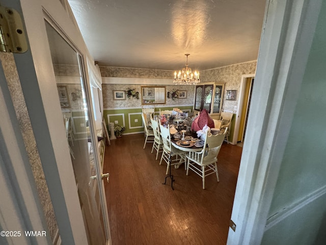 7525 E E Sherwood Rd, Snowflake, AZ 85937 - dining space with wallpapered walls, dark wood-style floors, a wainscoted wall, and a chandelier