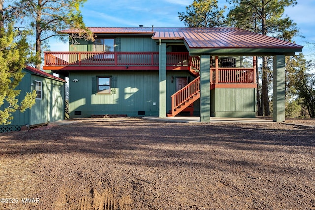 exterior space with crawl space, metal roof, and stairs
