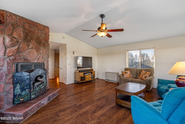 living area with ceiling fan, wood finished floors, and vaulted ceiling