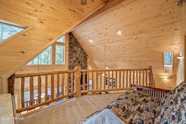 interior space featuring high vaulted ceiling, wooden ceiling, carpet floors, wood walls, and beam ceiling