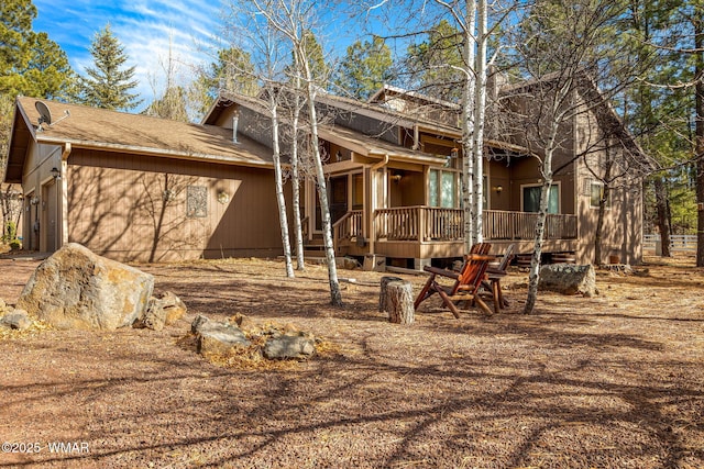 5712 Spruce Cir, Pinetop, AZ 85935 - rear view of house featuring a garage and a wooden deck
