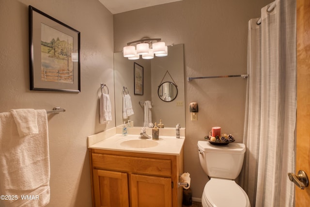 5712 Spruce Cir, Pinetop, AZ 85935 - bathroom with a textured wall, vanity, and toilet