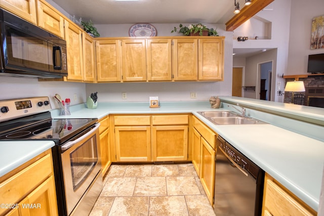 5712 Spruce Cir, Pinetop, AZ 85935 - kitchen with stone finish flooring, light countertops, a sink, and black appliances