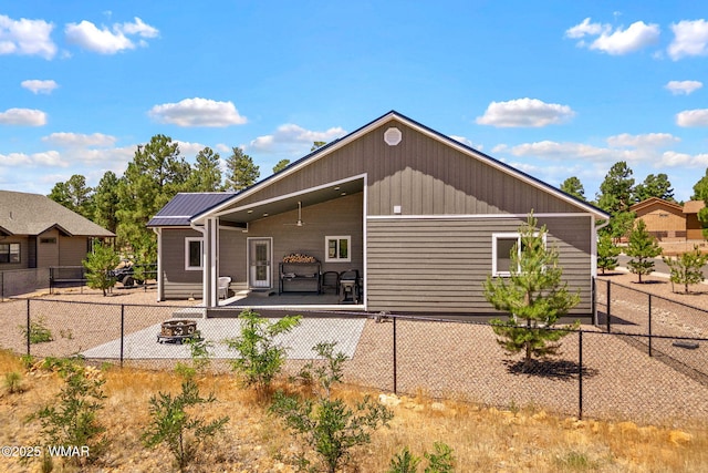 460 S Mountain Pines Ave, Show Low, AZ 85901 - rear view of property featuring a fire pit and a patio area