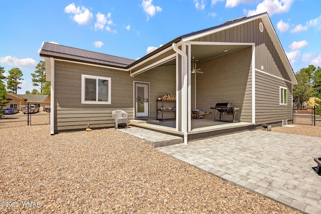 460 S Mountain Pines Ave, Show Low, AZ 85901 - rear view of property with a patio area and a metal roof
