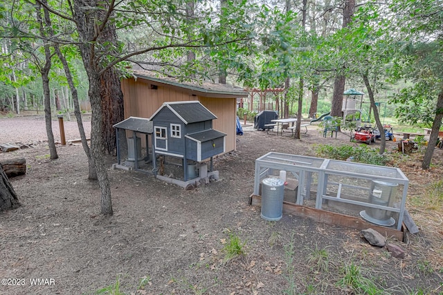 exterior space with an outbuilding and exterior structure