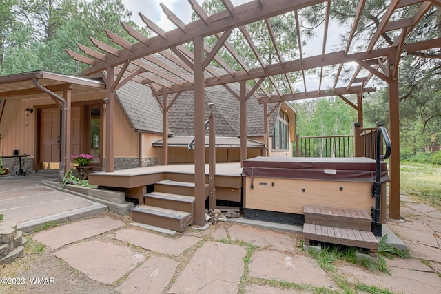 wooden terrace with a patio area, a hot tub, and a pergola