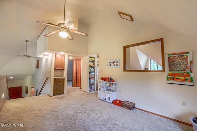 game room with baseboards, ceiling fan, high vaulted ceiling, and carpet flooring