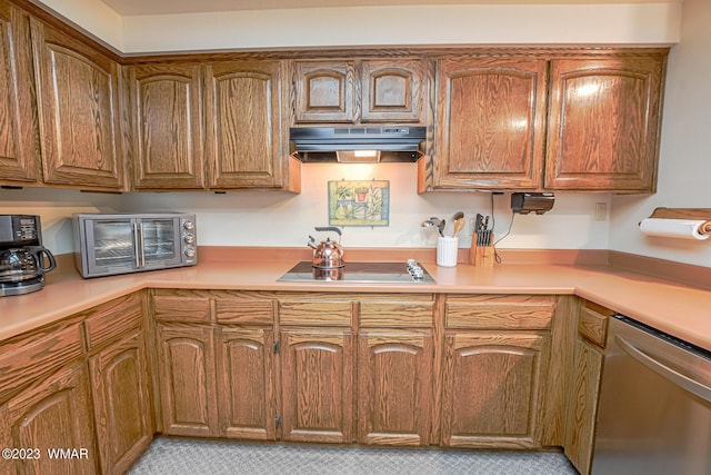 kitchen featuring black electric cooktop, under cabinet range hood, light countertops, dishwasher, and brown cabinetry