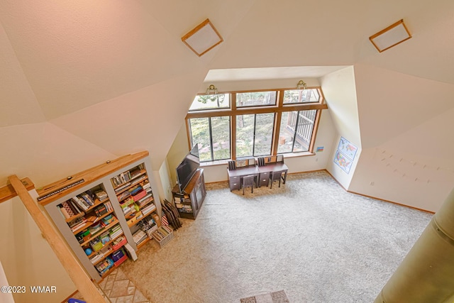 bonus room with lofted ceiling, carpet, and baseboards