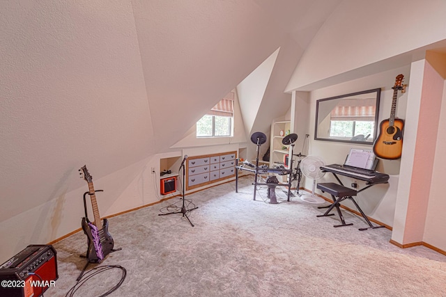 interior space with lofted ceiling, light carpet, and baseboards