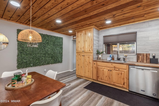 kitchen featuring a sink, wood ceiling, light countertops, dishwasher, and pendant lighting