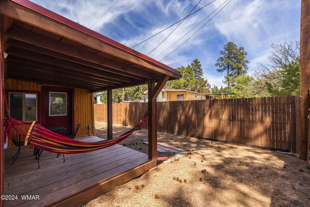 wooden deck featuring fence