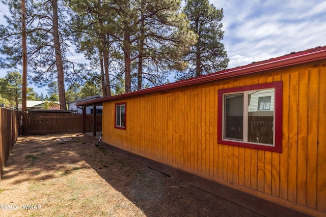 view of side of property with fence