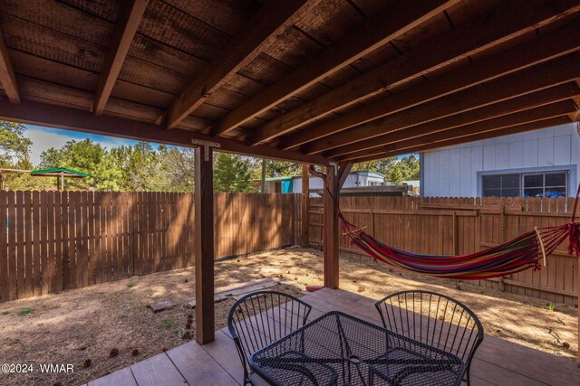 view of patio with outdoor dining space and a fenced backyard