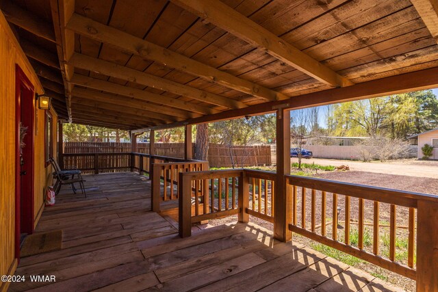 wooden terrace featuring a fenced backyard