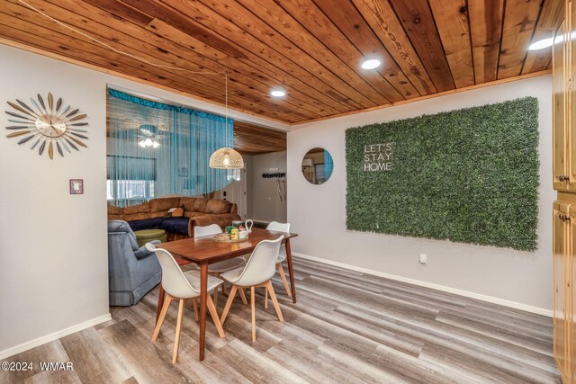 dining room with recessed lighting, wooden ceiling, baseboards, and wood finished floors