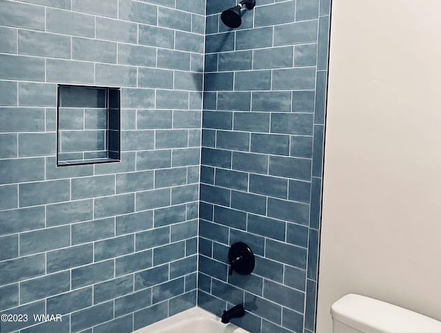 bathroom with toilet and shower / bathtub combination