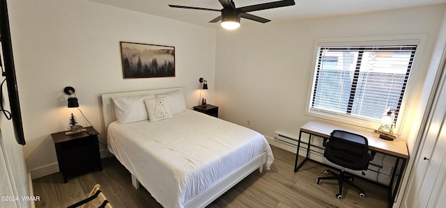 bedroom with dark wood-style floors, ceiling fan, and baseboards