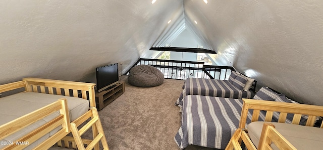 carpeted bedroom with vaulted ceiling, a textured wall, and a textured ceiling