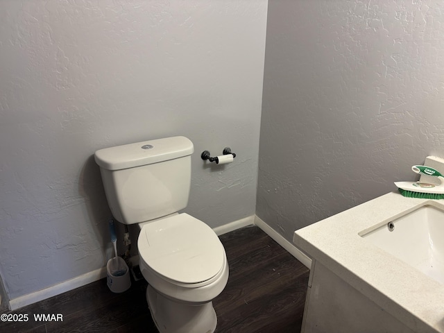 201 E Mcneil, Show Low, AZ 85901 - half bath with vanity, wood finished floors, and a textured wall