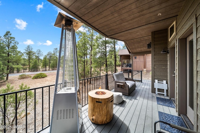3050 W Black Oak Loop, Show Low, AZ 85901 - wooden terrace featuring an outdoor fire pit