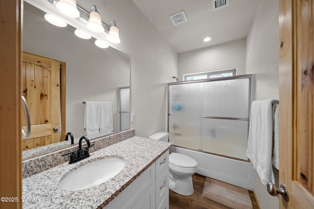 3050 W Black Oak Loop, Show Low, AZ 85901 - full bath featuring wood finished floors, toilet, combined bath / shower with glass door, and vanity