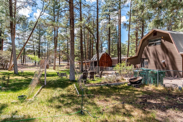 view of yard featuring a barn and an outdoor structure