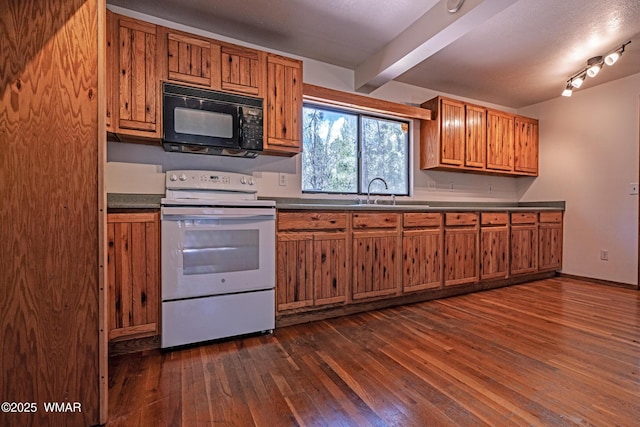 kitchen featuring black microwave, white electric range oven, a sink, brown cabinets, and beamed ceiling