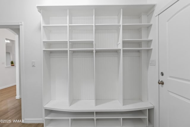 3401 W Hansen, Show Low, AZ 85901 - mudroom featuring arched walkways, wood finished floors, and baseboards