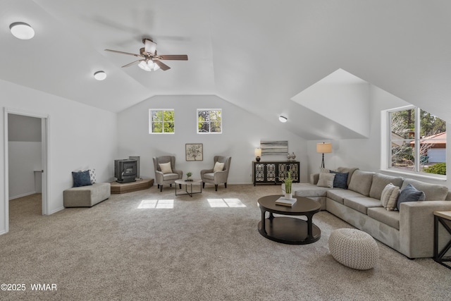 3401 W Hansen, Show Low, AZ 85901 - living room featuring a wood stove, vaulted ceiling, carpet, and ceiling fan