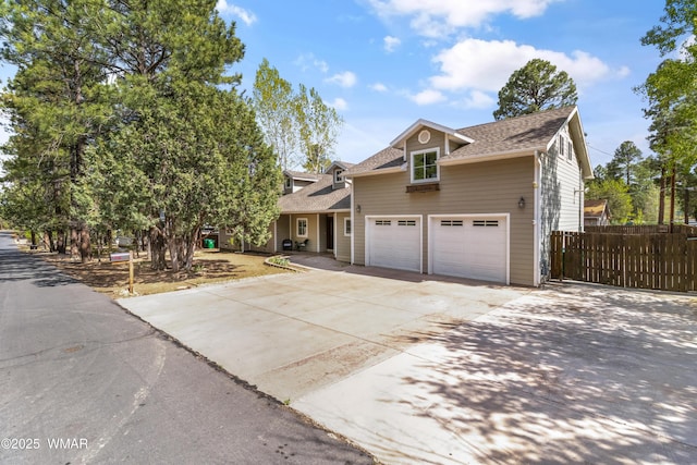 3401 W Hansen, Show Low, AZ 85901 - traditional-style home with fence, driveway, a shingled roof, and a garage