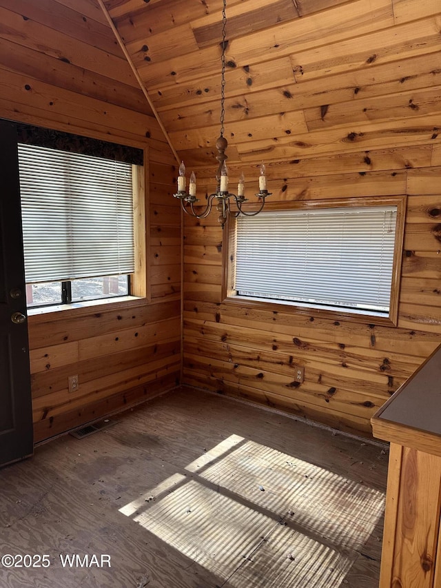 5528 Deer Run, Pinedale, AZ 85934 - unfurnished dining area with lofted ceiling, a chandelier, wood finished floors, wooden walls, and wood ceiling