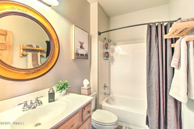 bathroom with toilet, shower / bath combo, and vanity