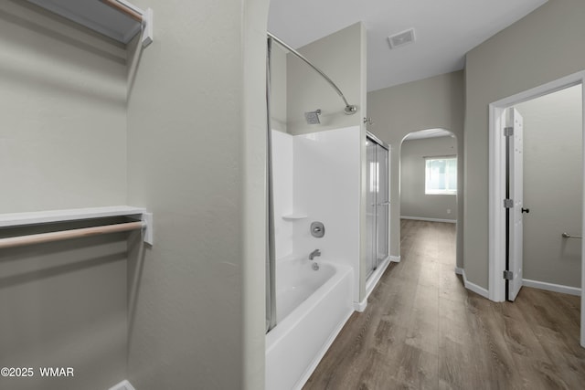 bathroom with visible vents, baseboards, and wood finished floors