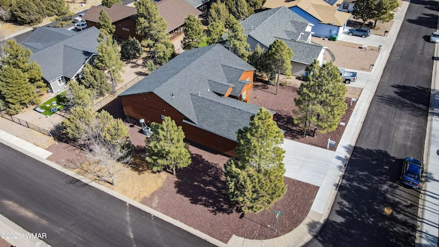 birds eye view of property with a residential view