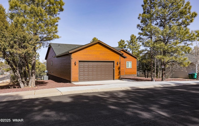 view of front of property with driveway and a garage