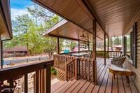 wooden terrace featuring covered porch