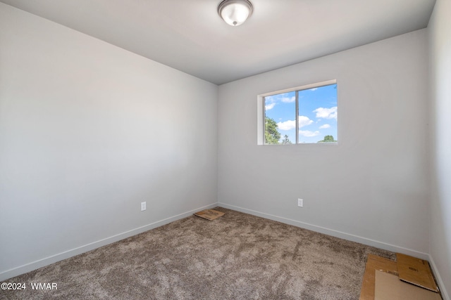 empty room with carpet flooring and baseboards