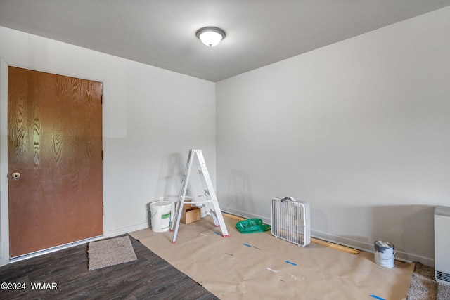 rec room with wood finished floors and baseboards