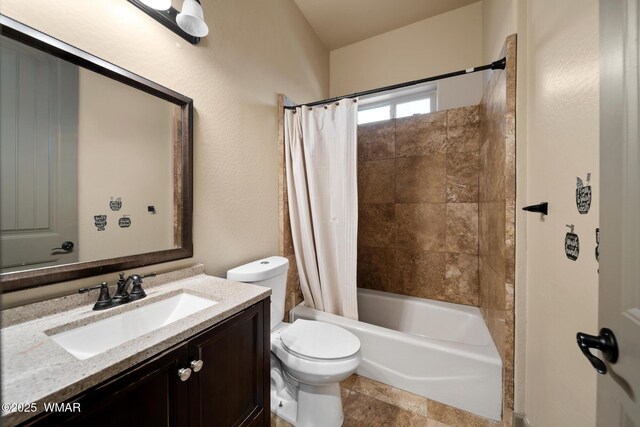 full bathroom featuring shower / tub combo with curtain, vanity, and toilet