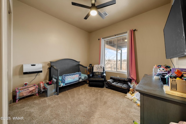 bedroom with a ceiling fan, visible vents, and carpet flooring