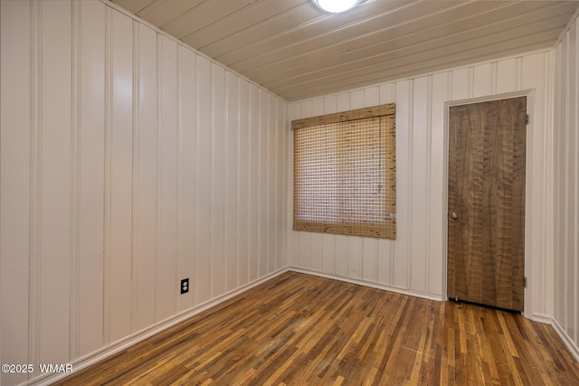 15 N 1st E St, Snowflake, AZ 85937 - unfurnished bedroom featuring hardwood / wood-style flooring and wooden walls