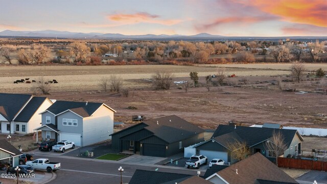 aerial view at dusk with a residential view and a mountain view