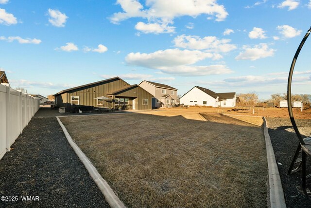 view of yard with a residential view and fence