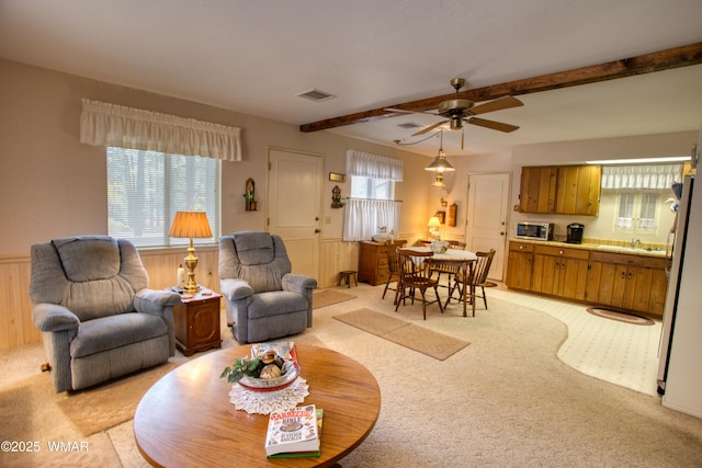 4300 W Burke, Show Low, AZ 85901 - living room with light colored carpet, beam ceiling, and ceiling fan
