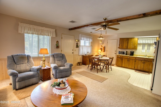 4300 W Burke, Show Low, AZ 85901 - living room featuring light colored carpet, beamed ceiling, and ceiling fan