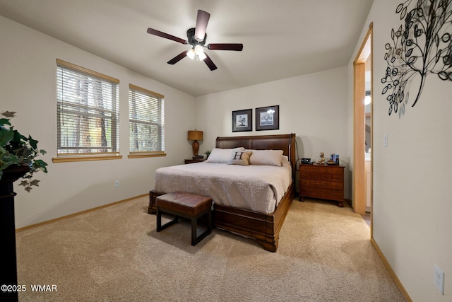 451 S Spirea Ln, Show Low, AZ 85901 - bedroom featuring light carpet, baseboards, and a ceiling fan