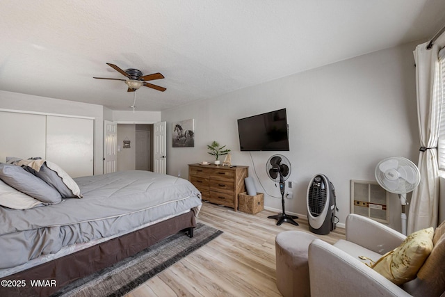 2670 Snow Slope Way, Pinetop, AZ 85935 - bedroom with light wood-type flooring, a closet, ceiling fan, and baseboards